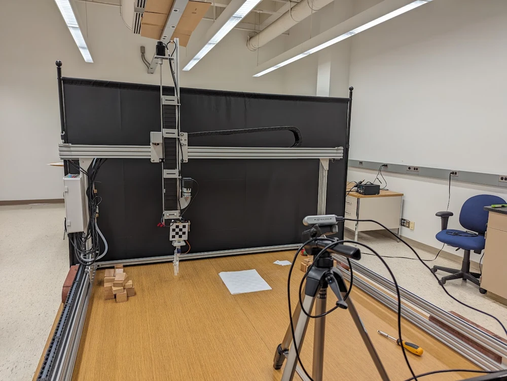 The research rig with a tripod-mounted camera and calibration target.
