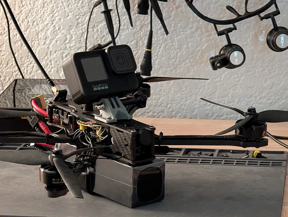 My camera-equipped FPV drone with its action camera mounted above the frame.