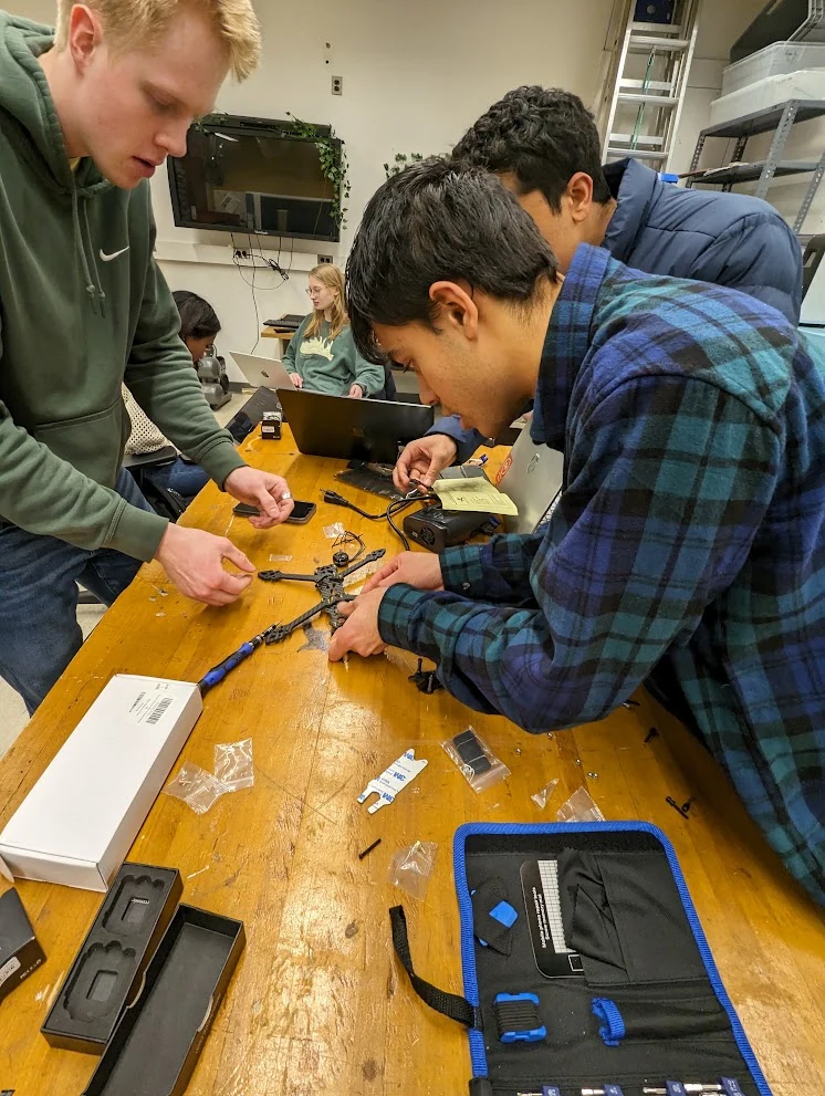 A drone build in progress: frame assembly, electronics, and wiring.