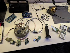 Circuit boards and electronics projects on the demonstration table.