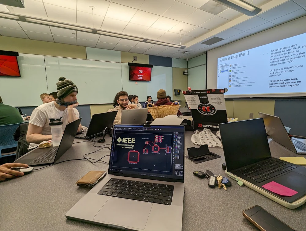 Working through circuit-board layouts in KiCad at a PCB design workshop.
