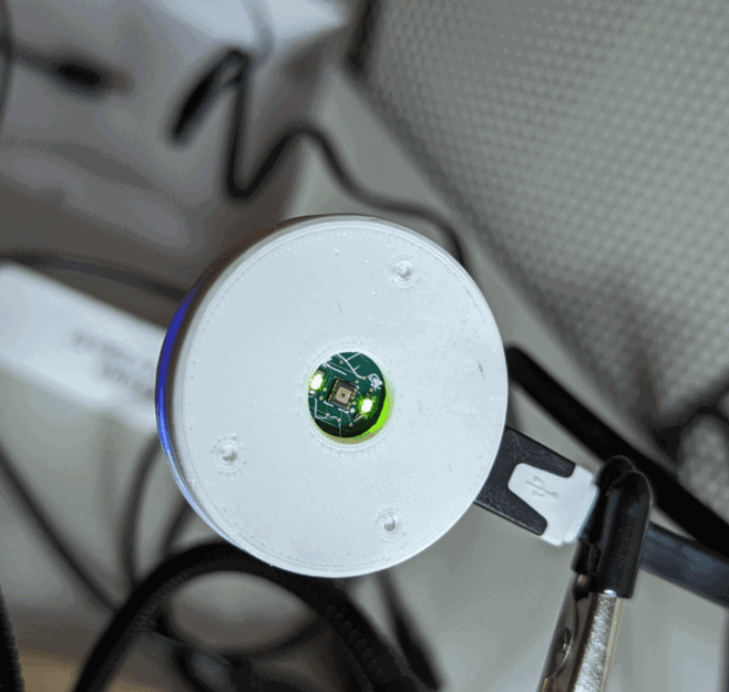 The white enclosure with an opening exposing the sensor board.