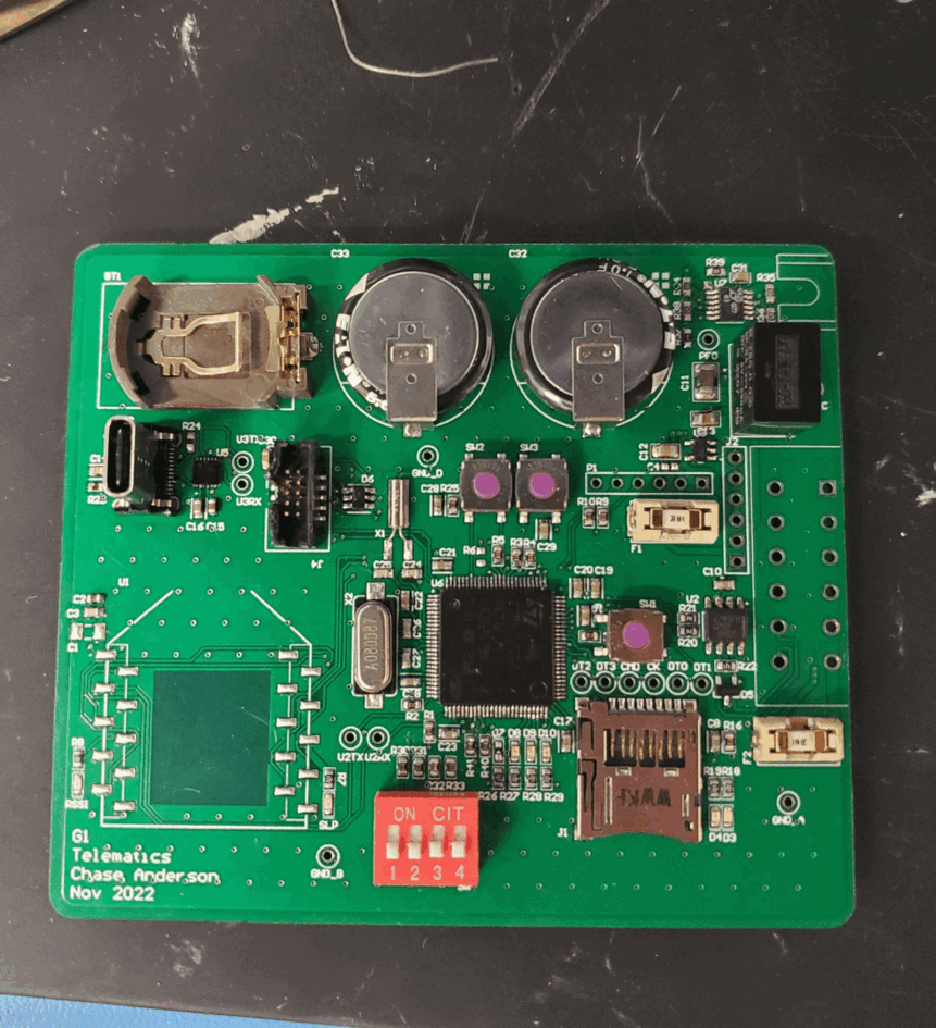 The populated telemetry circuit board with controls and connectors.